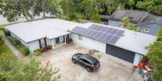 Lake Jessamine Luxury: Solar-Powered Waterfront Retreat on 1.14 Acres with Dock  Boathouse Gallery 1