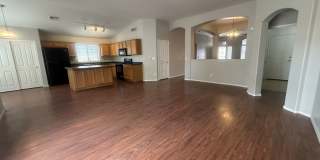 Single-level 3-bedroom home in a desirable Chandler location featuring a 2-car garage and tile roof and wood plank flooring throughout Gallery 18