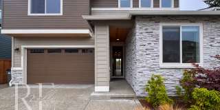 Naturally Lit 5-Bedroom Home with Fireplace, Main-Level Bedroom & Fenced Backyard Gallery 1