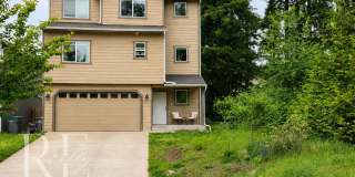 Spacious 3-Story Home with Flexible Living Space, Heat Pump & Private Deck Retreat Gallery 1