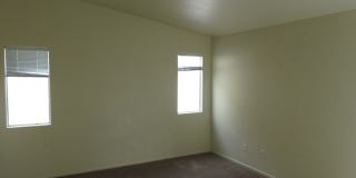 Huge family room with kitchen nicely tucked in the middle. Gallery 15