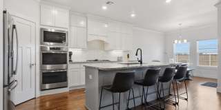 Stunner! This beautiful home features a spacious open floor plan with primary suite and private office on 1st level. Gallery 15