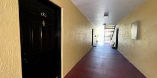 MOVE IN NOW!! Gated community Miriada! 1st floor 1X1.5 bath condo near pool area!!! Laminate wood flooring in living area and carpet in bedroom! Has washer & dryer! Gas stove & water heater! Gallery 5