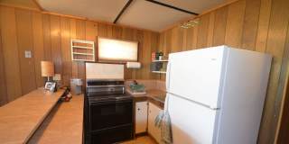 Garden level one bedroom apartment in the hills above BRECK.  Pets OK!  Includes HEAT and electric!  One Car Space in the Garage! Gallery 1
