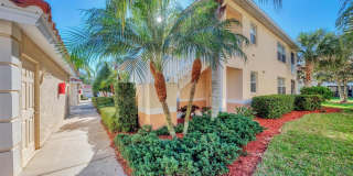 Elegant 3 Bedroom End-Unit Condo with Screened Lanai & Pond Views and A Private Garage Gallery 1