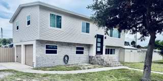 BEACHSIDE DREAM HOME WITH POOL, CANAL VIEWS & NO HOA Gallery 1