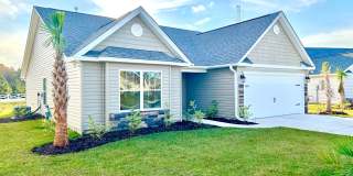 Discover your perfect home at 232 Sage Circle! Located in a quiet community just a few miles from the beach and major shopping areas, this stunning brand-new home offers modern living with coastal charm. Gallery 1