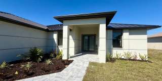 Brand-New Waterfront Luxury in Cape Coral | Heated Pool, Spa, Outdoor Kitchen & 3-Car Garage Gallery 4