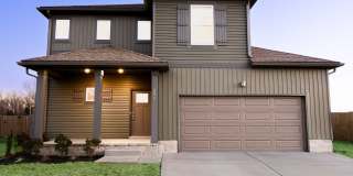 Charming Home With Eat In Kitchen, Granite Countertops, and Glass Door Tiled Shower Gallery 1