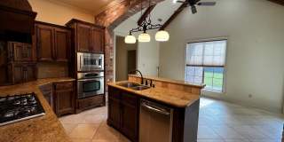 4 Bedroom, 3 Bathroom, Brick Home, Two Car Garage, Fireplace, High Ceilings, Granite Countertops, Fenced in Yard. Custom Built Home, Walkers Lake Subdivision , Triple-Split Floor Plan. Gallery 10