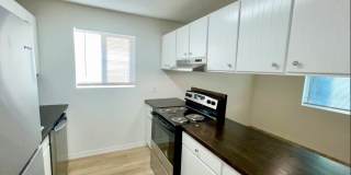 Spacious 2-Bedroom Apartment for Rent in Millwood Spokane Valley - Updated Unit with A/C, Stainless Appliances, and Covered Parking at 8921 E Liberty Ave Gallery 1