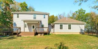 This beautiful 4 bedroom home at 109 SE 11th Ave in Gravette offers 2,601 square feet on a private 1 acre lot! Gallery 1