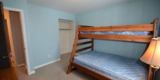 Blue River Condo! Bus route and additional storage! Year lease!  Unfurnished Gallery 1
