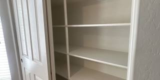 Single-level 3-bedroom home in a desirable Chandler location featuring a 2-car garage and tile roof and wood plank flooring throughout Gallery 17