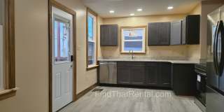 Pet friendly duplex w brand new kitchen & first floor LVP, basement, fenced yard, deck, near community pool Gallery 1