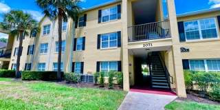 MOVE IN NOW!! Gated community Miriada! 1st floor 1X1.5 bath condo near pool area!!! Laminate wood flooring in living area and carpet in bedroom! Has washer & dryer! Gas stove & water heater! Gallery 1