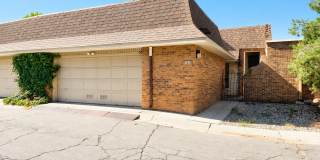 Incredibly spacious two-story condo in a NE heights neighborhood. Gallery 1