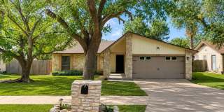 Charming 3/2 in NEISD with Stone Fireplace, Mature Trees & Spacious Backyard!  Conveniently located near shopping, restaurants, schools, Ft. Sam, Randolph AFB, parks, and major roadways. Gallery 1