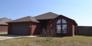 All brick beauty with fireplace and fenced yard! Gallery 1