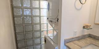 Sweeping Views from this partially furnished 1 Bed 1 Bath Condo w/ 1 Covered Parking Gallery 9