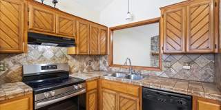 Charming 3-Bedroom Home with Stone Fireplace & Mature Trees Gallery 7