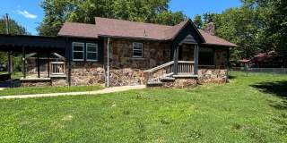 Charming 3-Bedroom Stone Home with Spacious Yard Gallery 1