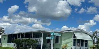 Updated Coastal 2BR/2BA Corner Lot Home in Gated 55+ Resort Gallery 1
