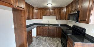 Spacious 6-Bedroom Magna Home with Fenced Yard Gallery 1