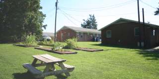 Private carport, in-unit laundry, and the Lakewood strip right outside your door. Gallery 16