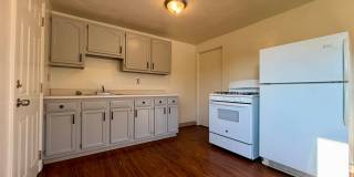 Charming Two Bedroom Townhome with a Private Basement & a Shared Backyard Space! Call Today! Gallery 1
