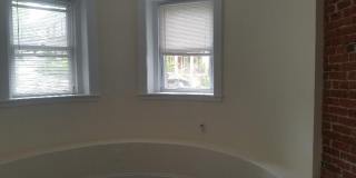 Nicely updated ground level 1 bed with in-unit laundry near the Green Line. Gallery 5