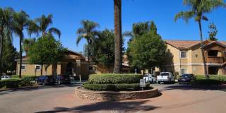 Spacious single-story, ground-level corner unit located in a desirable gated community. Gallery 1