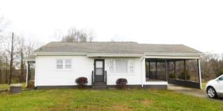 Home with 2 bedrooms, 1 bath, side deck, carport with side porch and detached garage Gallery 1
