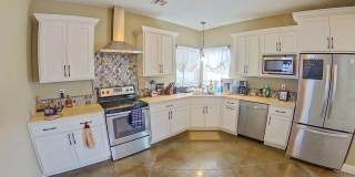 Cute West Side Home W/ Two Car Garage + Fenced In Yard + Rooftop Balcony! Available June 4th! Gallery 1