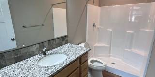 4 Bedroom / 4 bath New Townhome. Every bedroom is its own Master Suite with your own full bathroom, walk in closet and A/C unit. Full-size washer and dryer in your unit. Gallery 15