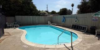 2BR/1BA Lakeside ground floor condo with 1 car detached garage, 1 uncovered parking space & community pool. Gallery 15