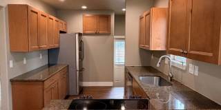 Spacious 2 bed/1 bath home! Fenced yard, a/c, d/w, w/d, large garage and MORE!! Gallery 10