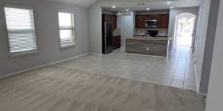 2 car garage with lighting, granite countertops. Backyard includes a custom extended concrete patio perfect for gatherings Gallery 29