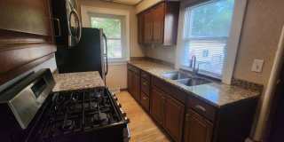 Fully fenced yard with stainless steel appliances including gas stove! Gallery 4