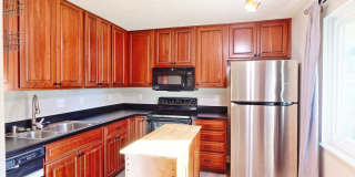 Spacious 3-Bedroom Condo with Finished Basement & Private Fenced Yard! Gallery 1