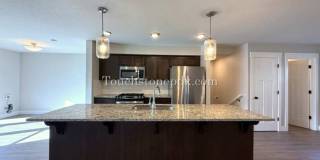 Modern Open Concept 3 Bedroom Home with Balcony and Attached Garage Gallery 1