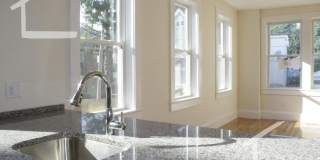 Nicely renovated Townhouse in a prime location near the Green Line with parking included! Gallery 18