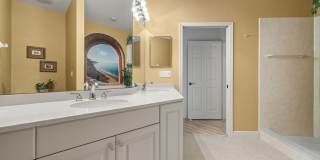 Experience Bell Tower Park. GATED ground floor 2 Bed 2 Bath Den 1 Car Garage Condo. Gallery 19