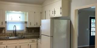 Travelers Rest !! 3 BR, 2 BA with Great Living Space - Den, Bonus Room, Primary Suite has a HUGE walk in Closet, Laundry Room, private screened in porch & deck AND a storage shed out back.  Fresh Paint and New LVP Floors Gallery 8