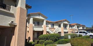Upstairs condo in the Remington of Rancho San Diego with laundry a parking spot near all grades of school Gallery 1