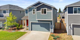 Spacious 4-Bedroom Home with Bonus Room, Main-Floor Den & Covered Patio Near JBLM Gallery 1