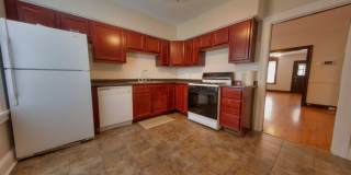 This completely refinished two-bedroom, one-bathroom home features brilliant hardwood floors throughout. This completely refinished two-bedroom, one-bathroom home features brilliant hardwood floors throughout. Gallery 1
