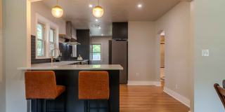 Completely remodeled like new Gingerbread midtown cottage with gleaming hardwoods, converted from a 3/1 to a 3/2. Gallery 22