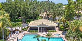 ** VILLAGES OF EMERALD BAY ** FIRST FLOOR 2 BEDROOM PLUS A DEN\2 BATH CONDO WITH LAKE VIEW ** NORTH NAPLES ** SEASONAL ** Gallery 1