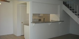 Enjoy townhouse living close to the beach. Gallery 1